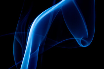 A photo of smoke that has a beautiful billowing appearance. Suitable for making background images.