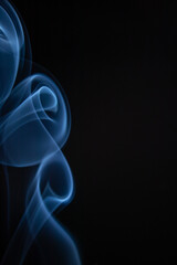 A photo of smoke that has a beautiful billowing appearance. Suitable for making background images.