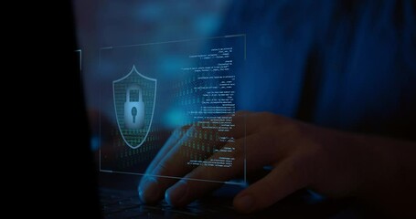 Man Using A Notebook In The Dark checking for cyber security problems with an encrypted software - Powered by Adobe