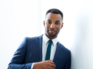 Black businessman, portrait and confidence in office with suit, skills and investment banking career. Face, broker and African banker in commercial or corporate institution with modern style or pride
