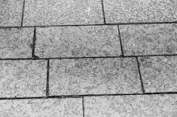 City pavement texture, brick road pattern made of granite black and white background. Pencil sketch drawing illustration