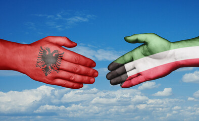 Kuwait and Albania country handshaking with flags, consensus concept international co-operation illustration