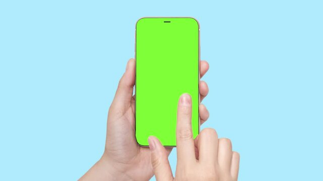 A woman's hand holds a phone chromakey Mockup and the second hand with a finger scrolls. Isolated on blue background animation video 4k