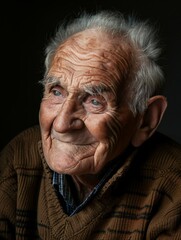 Obraz premium Wise Elderly Man With a Warm Smile, Portrait of Experience and Wisdom.