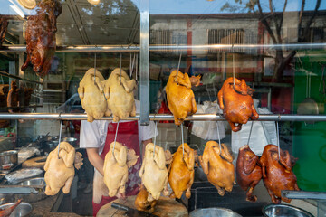 Naklejka premium The roasted meat restaurant is displaying delicious roasted chicken