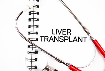 LIVER TRANSPLANT word,text on stethoscope notebook. Liver transplantation medical concept.