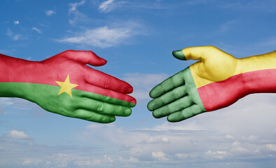 Benin and Burkina Faso country handshaking with flags, consensus concept international co-operation illustration