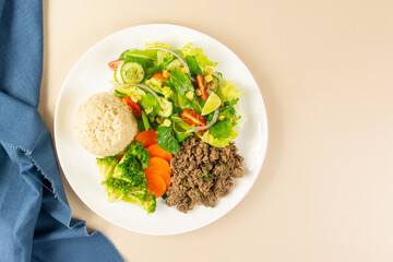 Healthy Plate with Ground Beef, Brown Rice, Vegetables, and Fresh Salad