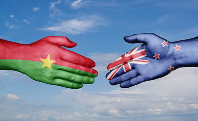 New Zealand and Burkina Faso country handshaking with flags, consensus concept international co-operation illustration