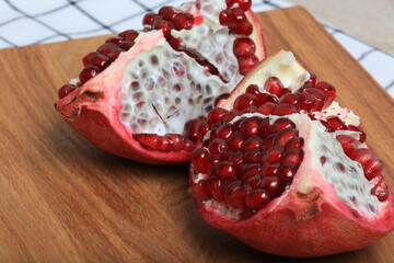 pomegranate on wooden board