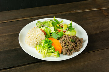 Healthy Plate with Ground Beef, Brown Rice, Vegetables, and Fresh Salad