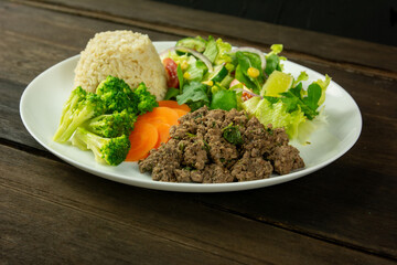 Healthy Plate with Ground Beef, Brown Rice, Vegetables, and Fresh Salad