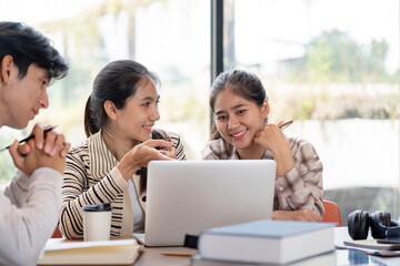 Group of Diverse Student Collaboration on a Project with a Laptop in a Modern Study Space