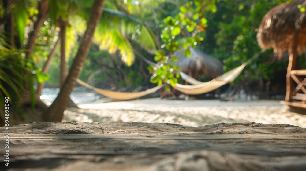 Poster a wooden surface sits in the foreground of a tropical beach scene with palm trees, white sand, and t