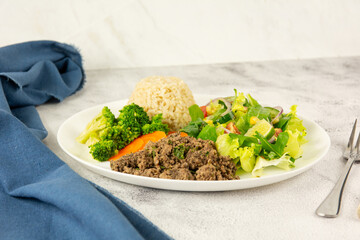 Healthy Plate with Ground Beef, Brown Rice, Vegetables, and Fresh Salad