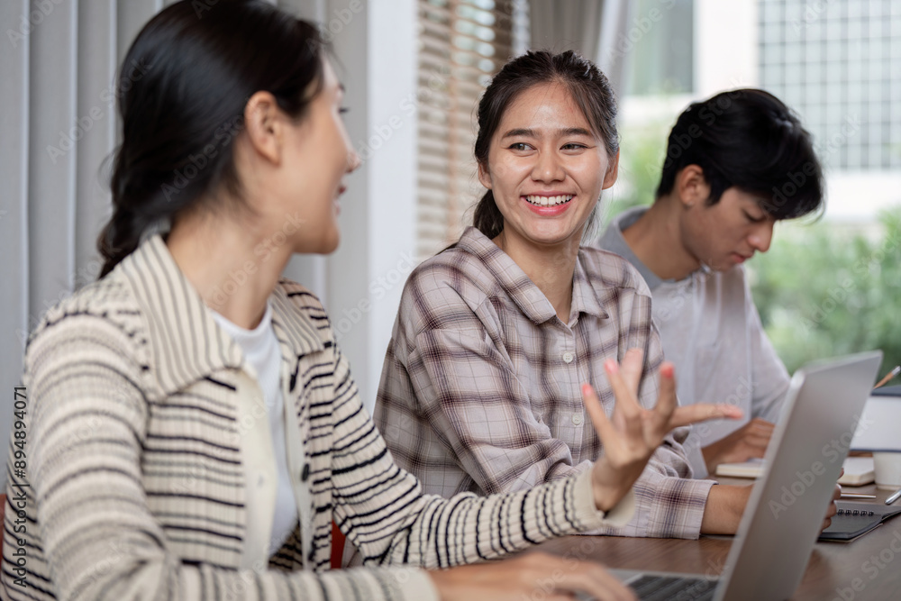 Poster diverse group of students studying together with laptops in a modern classroom setting