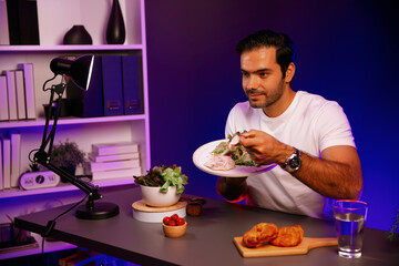 Healthy influencer in host channel tasting chicken meat ingredient health on diet life in mixed salad for easy cooking product by self with tasty food on social media live on meal time. Surmise.