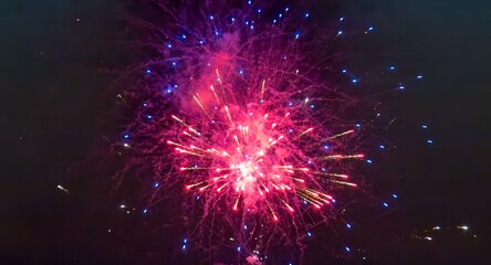 Bright flares fade into smoke.