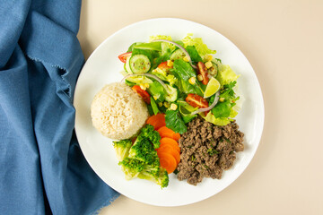 Healthy Plate with Ground Beef, Brown Rice, Vegetables, and Fresh Salad