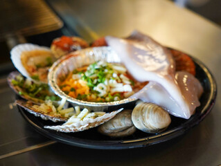 Grill seafood and various clams on fire