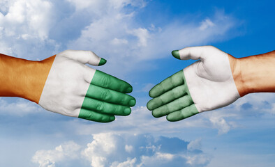 Ireland and Ivory Coast country handshaking with flags, consensus concept international co-operation illustration