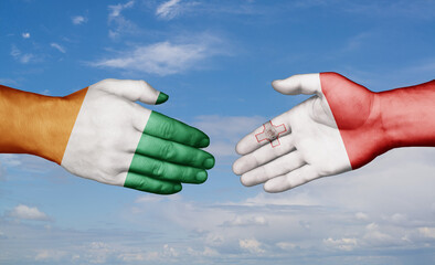 Malta and Ivory Coast country handshaking with flags, consensus concept international co-operation illustration