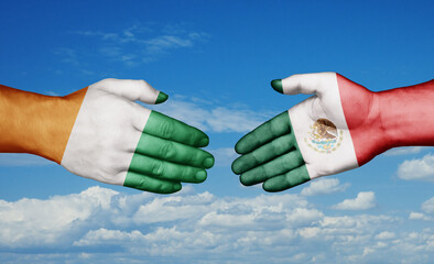 Mexico and Ivory Coast country handshaking with flags, consensus concept international co-operation illustration