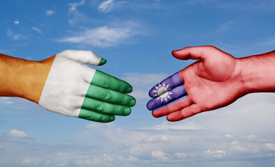 Taiwan and Ivory Coast country handshaking with flags, consensus concept international co-operation illustration