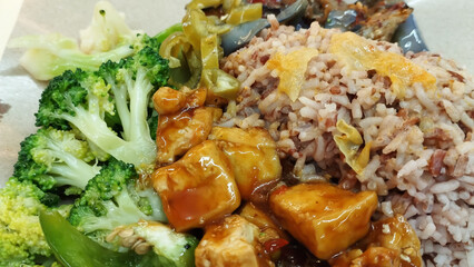 mixed vegetarian cuisine with brown rice and green chilies