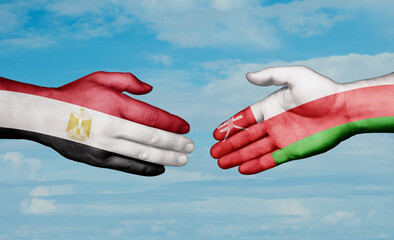 Oman and Egypt country handshaking with flags, consensus concept international co-operation illustration