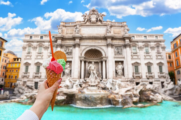 Italian ice cream gelato in front of amazing Trevi Fountain in Rome, Italy.
