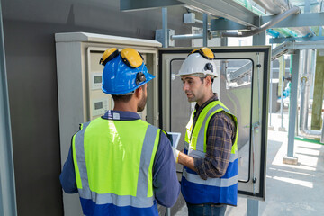 Engineers Collaborating and Smiling in Industrial Setting