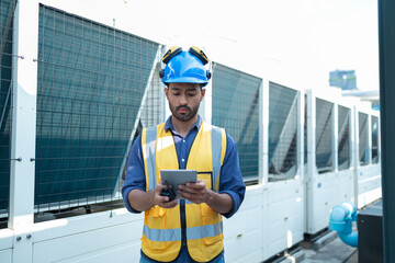 Fototapeta premium Technician Operating Control Panel in Industrial Setting