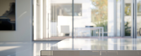 Modern glass table top. A close-up shot of a sleek, modern glass table top, with a blurred background of a bright, open space.