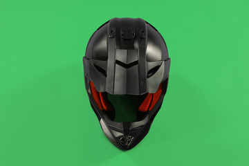 Modern motorcycle helmet with visor on light green background, top view