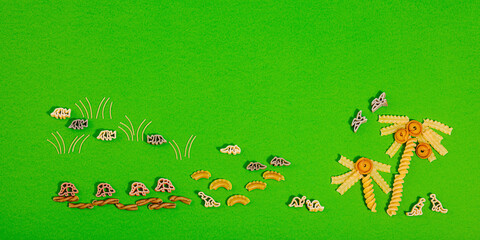 Pasta. Various kinds of uncooked pasta and noodles over wooden background