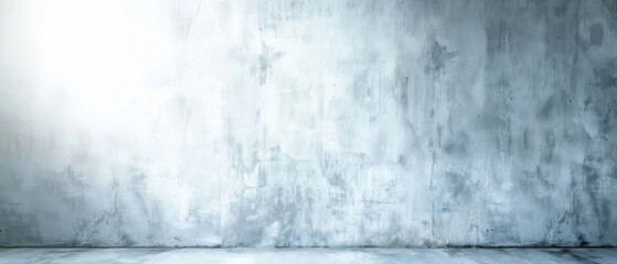 Obraz premium A large, empty wall with a white background. The wall is made of concrete and has a rough texture. The sunlight is shining on the wall, creating a bright