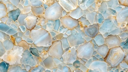 A close up of a smooth stone surface with various hues of blue white and grey