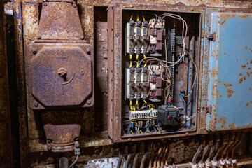 Old electrical plugs and switches in an industrial building
