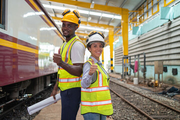 Railway Engineers Evaluating Plans at Train Depot