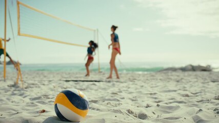 Beach volleyball rally during a championship match on a sunny beach