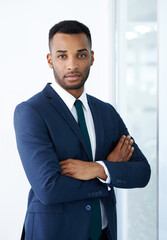 Portrait, arms crossed and black man in office with suit for corporate career, job or pride. Face, business and confident professional entrepreneur, worker and insurance agent in workplace in Nigeria