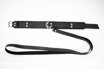bdsm and fetish black leather neck choker collar with metal leash on white background isolated