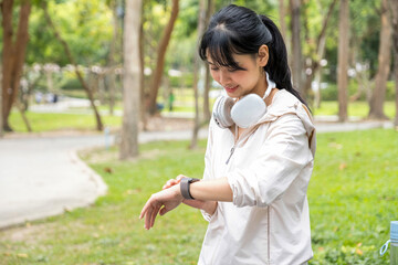 Healthy woman checking smart watch.