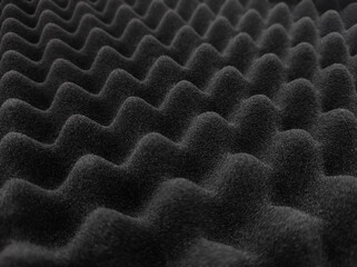 Wave texture of accoustic foam. Sound diffuser close-up surface. Soundproof material background.