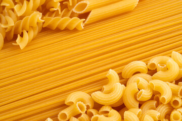 Close up elbow macaroni pasta and spaghetti for background.Selective focus