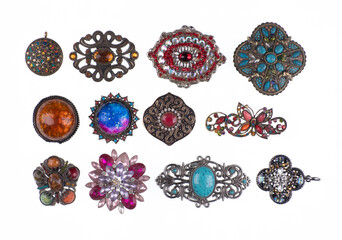collection of jewelry brooches with precious stones isolated on white background