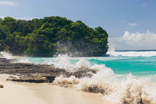 Pristine turquoise ocean water and white sand beach on an island in the Indian Ocean, Southeast Asia; Patiala Bawa, Lamboya, West Sumba Regency, East Nusa Tenggara, Indonesia