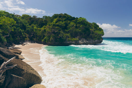 Pristine turquoise ocean water and white sand beach on an island in the Indian Ocean, Southeast Asia; Patiala Bawa, Lamboya, West Sumba Regency, East Nusa Tenggara, Indonesia