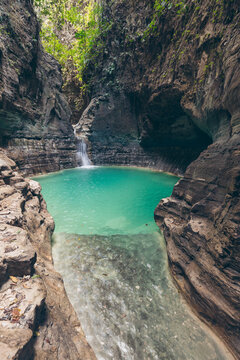 Stunning lagoon and waterfall at Air Terjun Wai Marang on the island of East Nusa Tenggara, Indonesia; Ngaru Kanoru, Umalulu, East Sumba Regency, East Nusa Tenggara, Indonesia